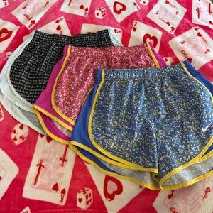 Nike Women's Shorts: “just do it” print, pink splatter, and blue splatter